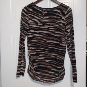 Exotic, animal print long sleeved top. Ruched sides,curved hem,sheer sleeves.